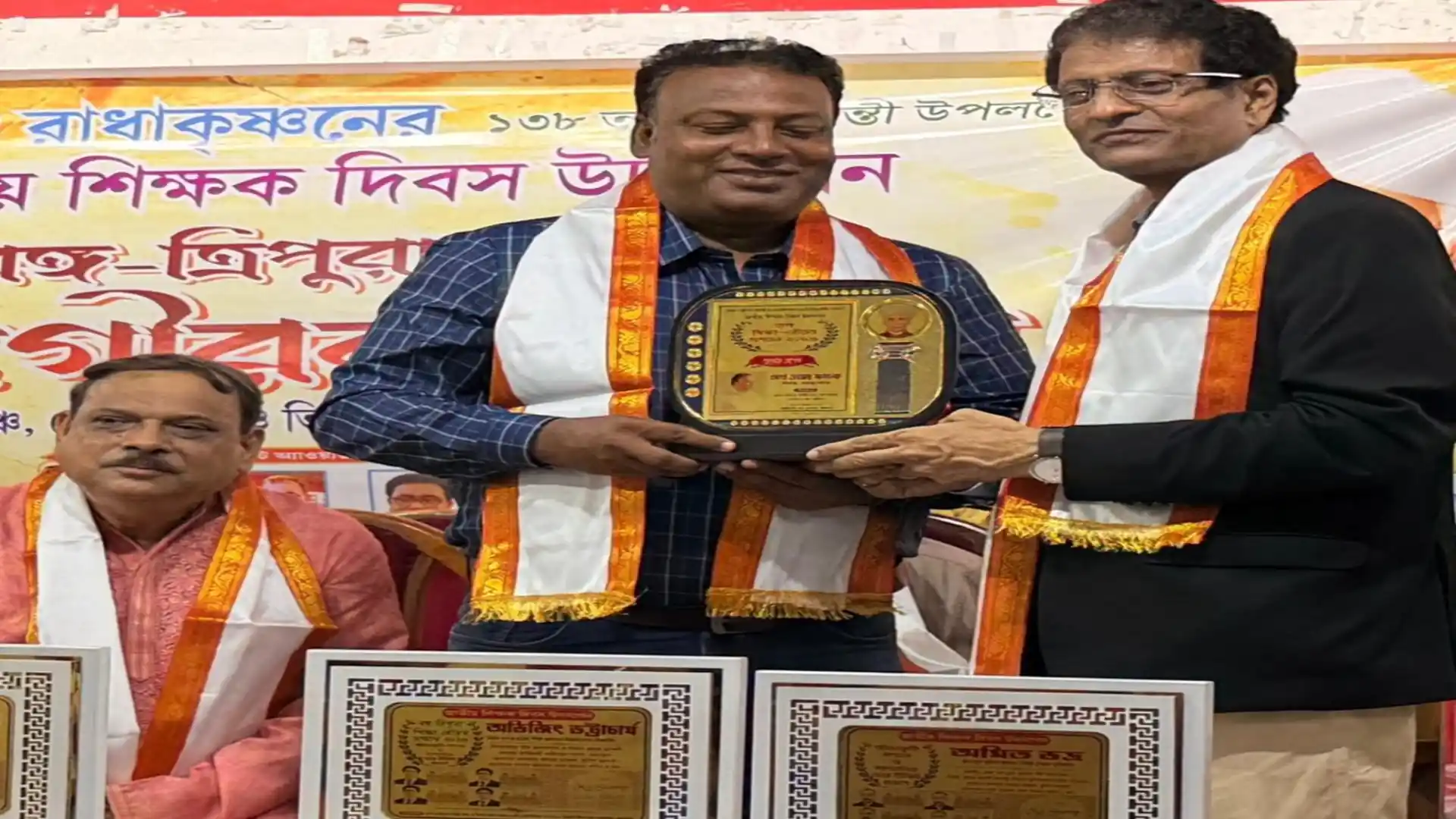 Abhijit Bhattacharjee receives memento and citation for 39 years of educational service
